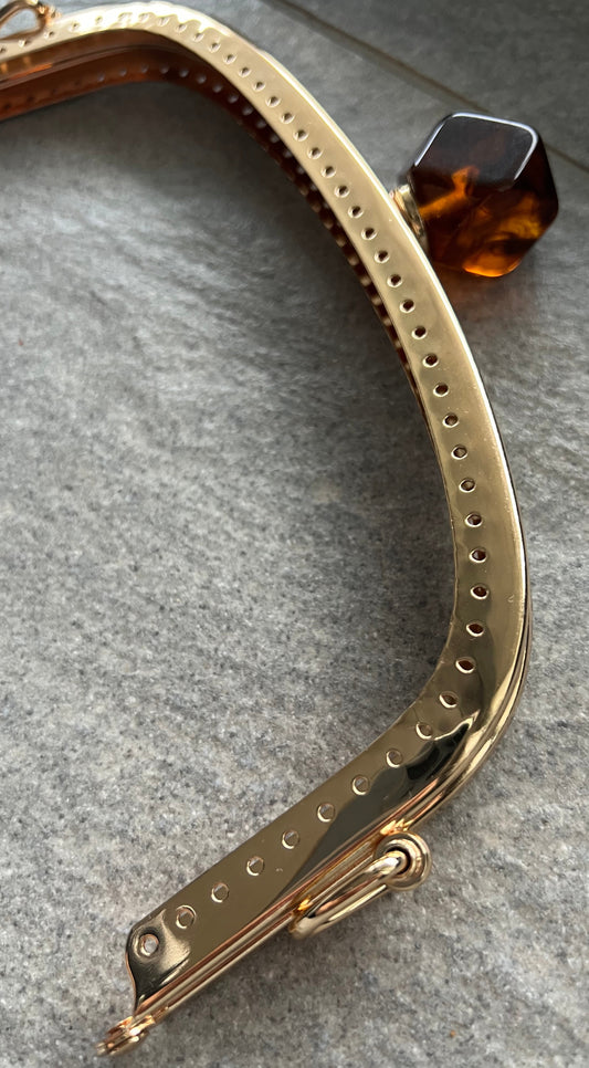 Chiusura Clutch Oro/Ambra